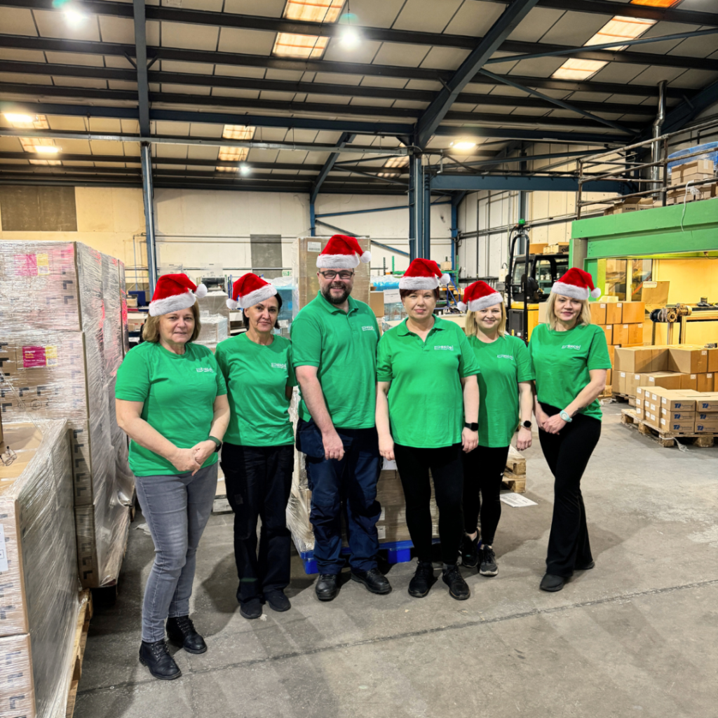 This is a picture of the Excel Contract Packing team in Christmas hats to show 🎄The 12 Hidden Costs of Christmas (That Manufacturers Shouldn’t Be Paying for in 2026)