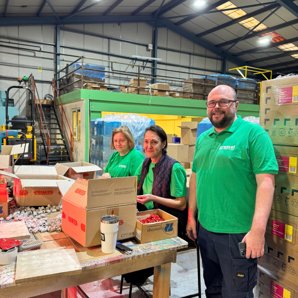 This is a picture of the Excel Contract Packing team packing products to demonstrate 'Not Sure If Outsourcing Your Packing Is Worth It? Test It First'